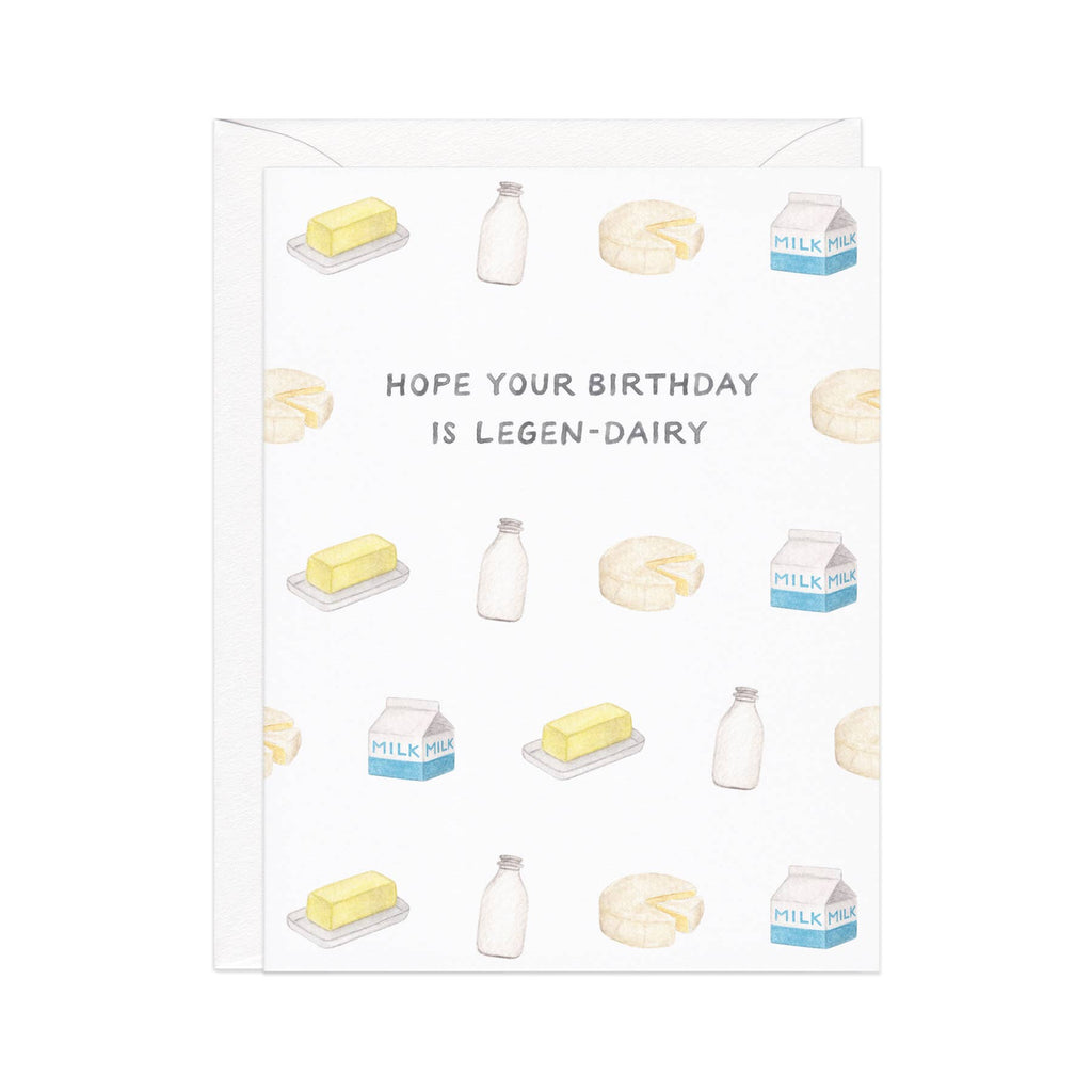 Greeting card with white background  with images of cheese, butter, milk and black text says, "Hope your birthday is legen-dairy".  White envelope is included, 