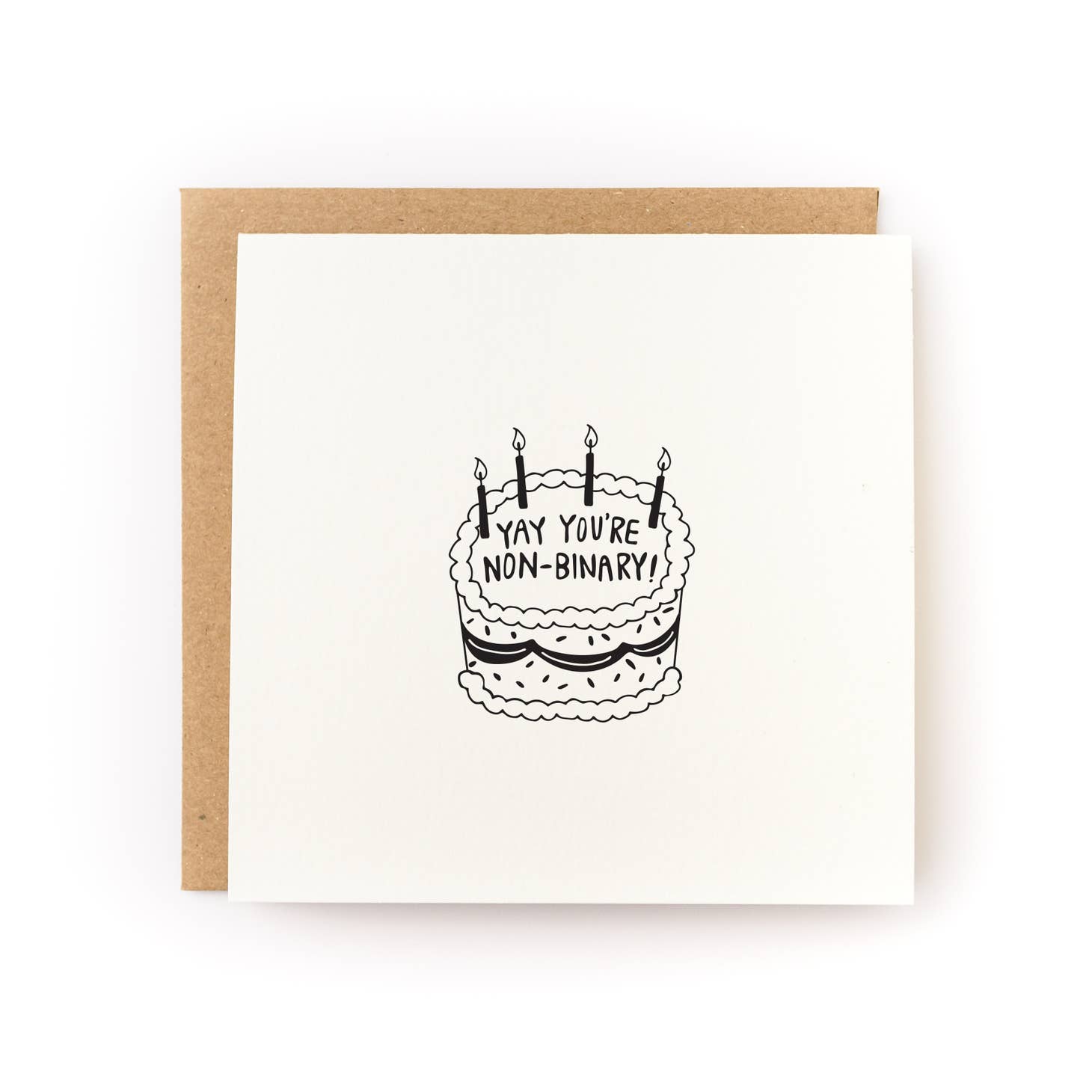 Greeting card with cream background with an image of a cake with black text says, "Yay You're Non-Binary!". Kraft envelope is included. 