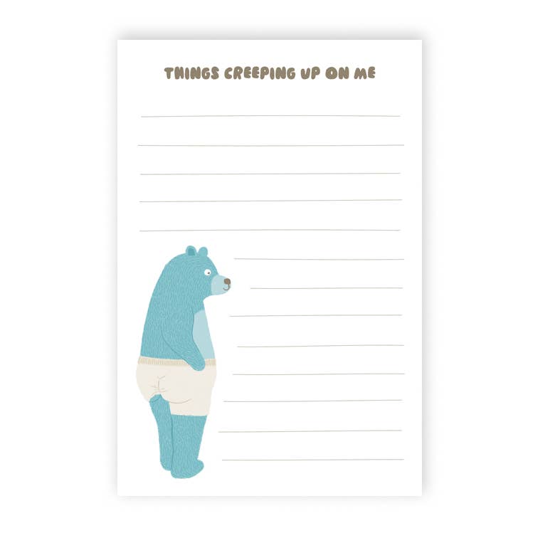 Image of note pad with white background and grey text at top says, "Things creeping up on me" and light grey lines for writing. Image of a blue bear wearing white underwear that are creeping up his butt. 