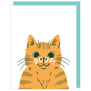 Greeting cart with white background and image of an orange cat with white text says, "Boop" on its nose. Teal envelope included. 