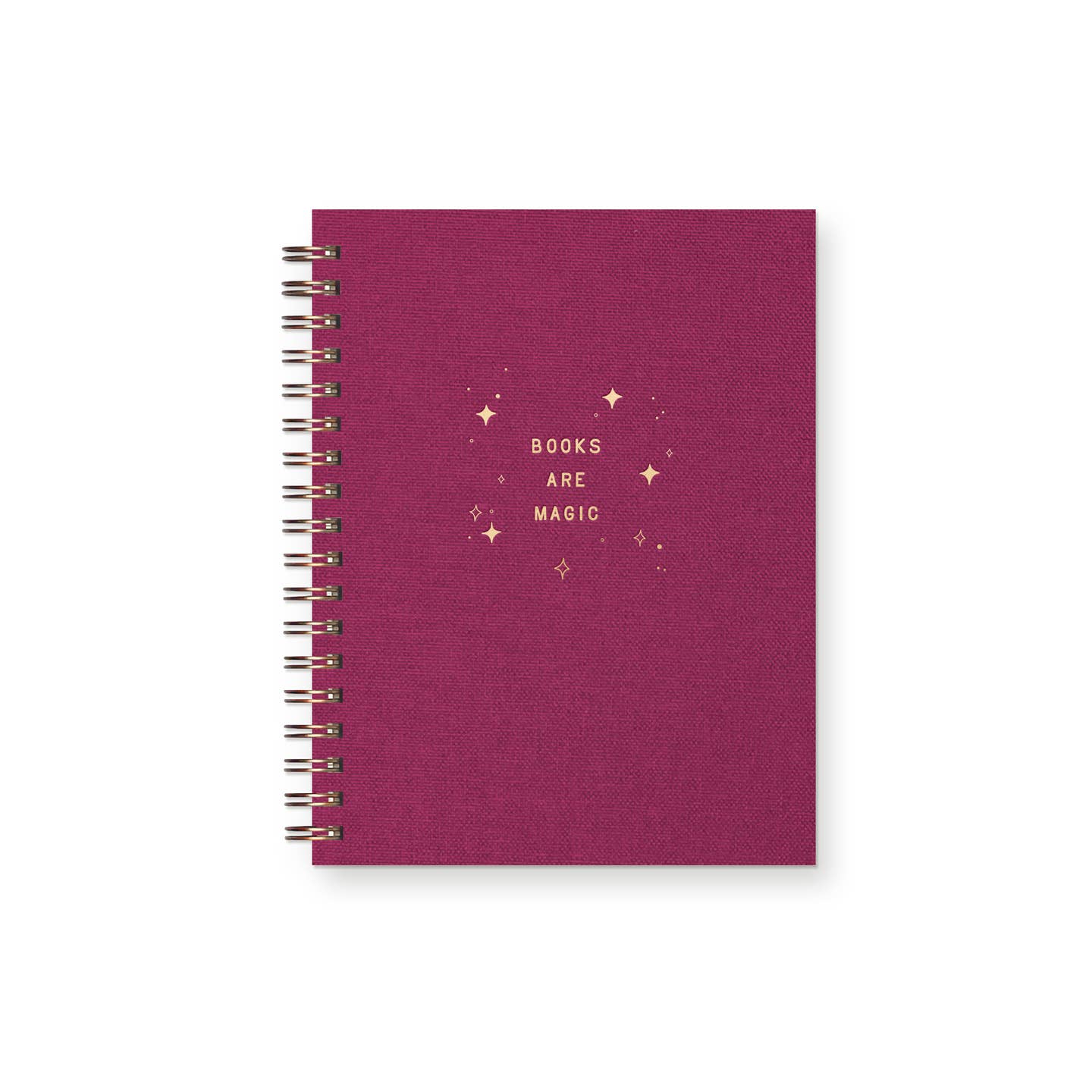 Notebook cover in dark rose with gold foil text says, "Books are magic" and star bursts. Gold coil binding.