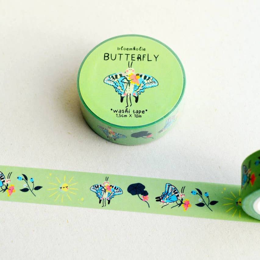 Image of washi tape with mint green background and images of butterflies in blue, white and black, yellow suns and pink and blue flowers.