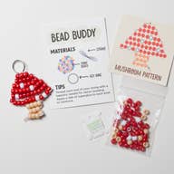 Image of red and tan mushroom made from beads with kit and instructions. 