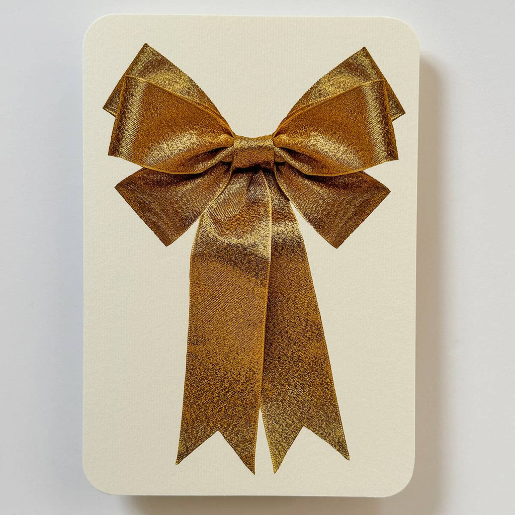 Greeting card with cream background with image of a gold bow. Envelope included.