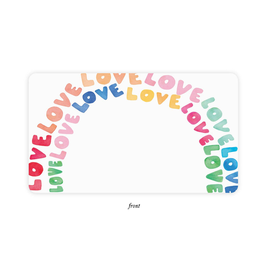 White background with rainbow made with “LOVE” in rainbow colors.
