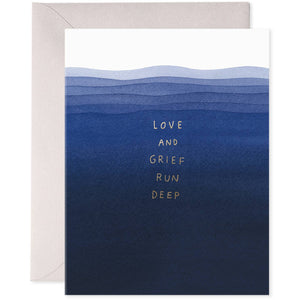 Greeting card with blue ombre colors from dark at bottom to light blue at top with grey text says, "Love and grief run deep". Grey envelope included.