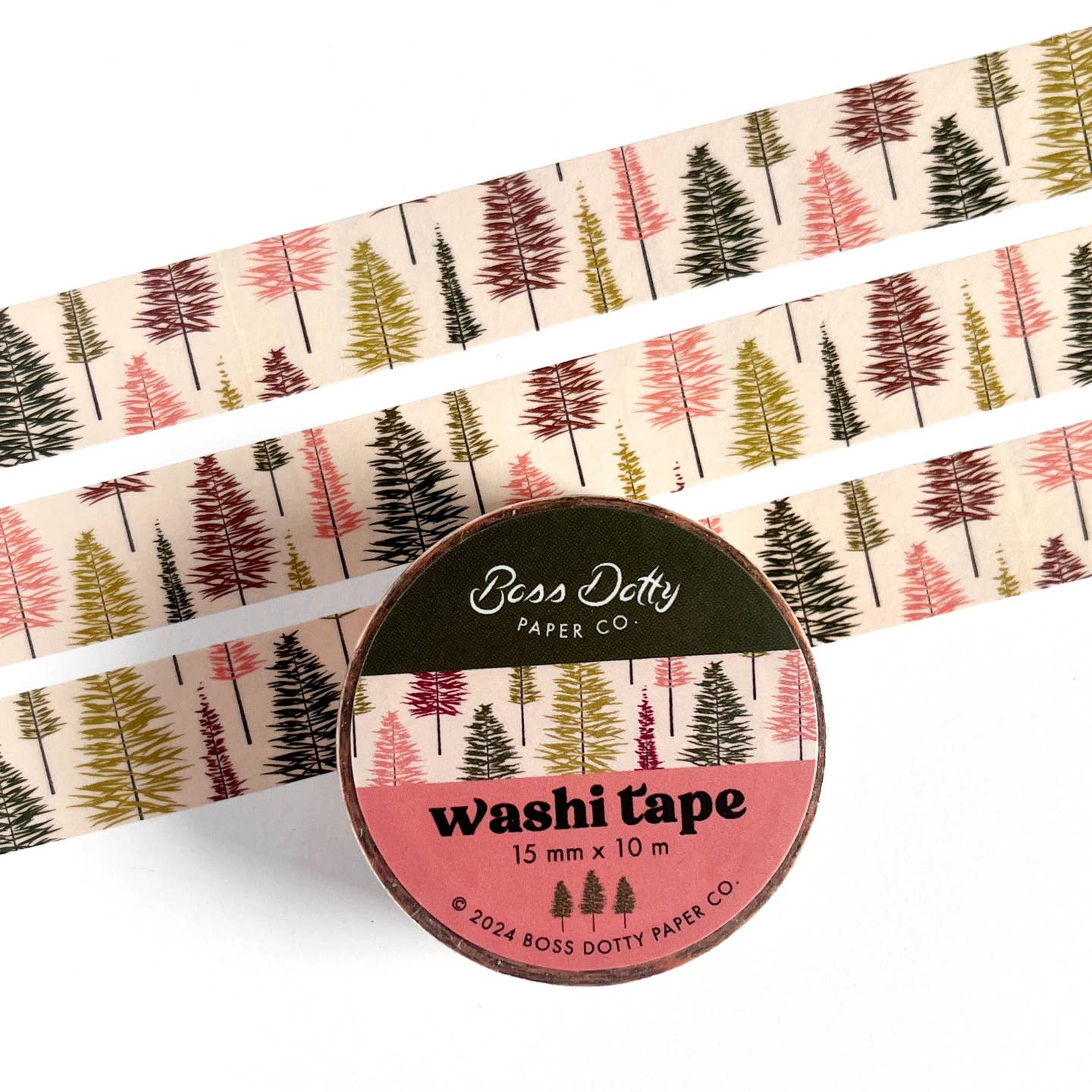 Decorative tape with tan background and images of trees in pink, olive, dark green and burgundy. 