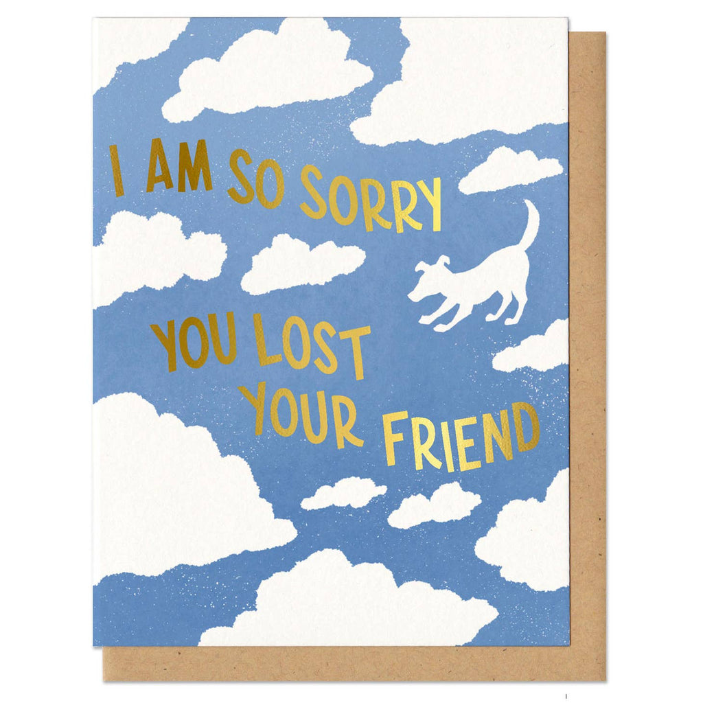 Greeting card depicting clouds in a blue sky, one cloud shaped like a dog. Text says "I am so sorry you lost your friend" in gold foil.