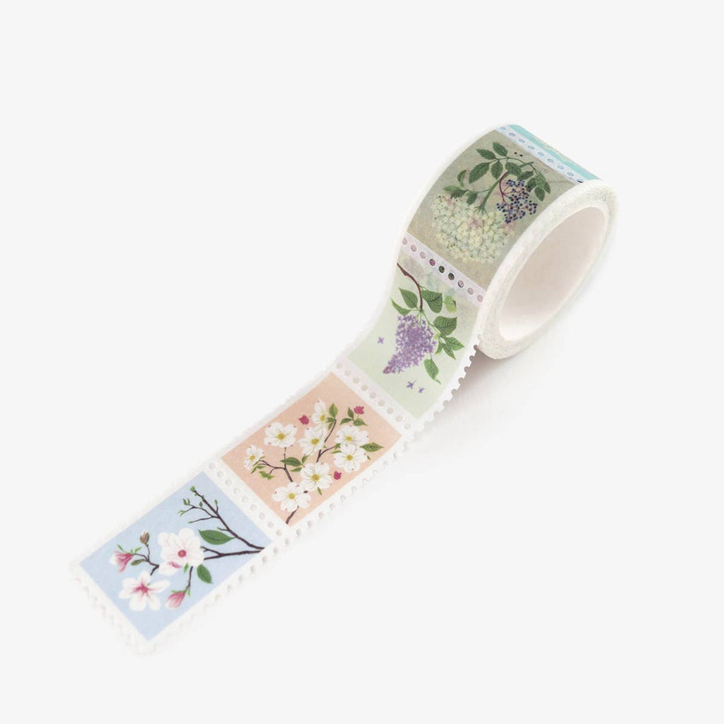 Stamp edged washi tape with images of flowers including white dogwood, lilacs and white queen Anne’s lace.        
