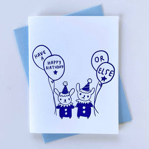 Greeting card with white background with image of tow clown bunnies holding balloons. Purple text says, "Have a happy birthday or else". Blue envelope included. 