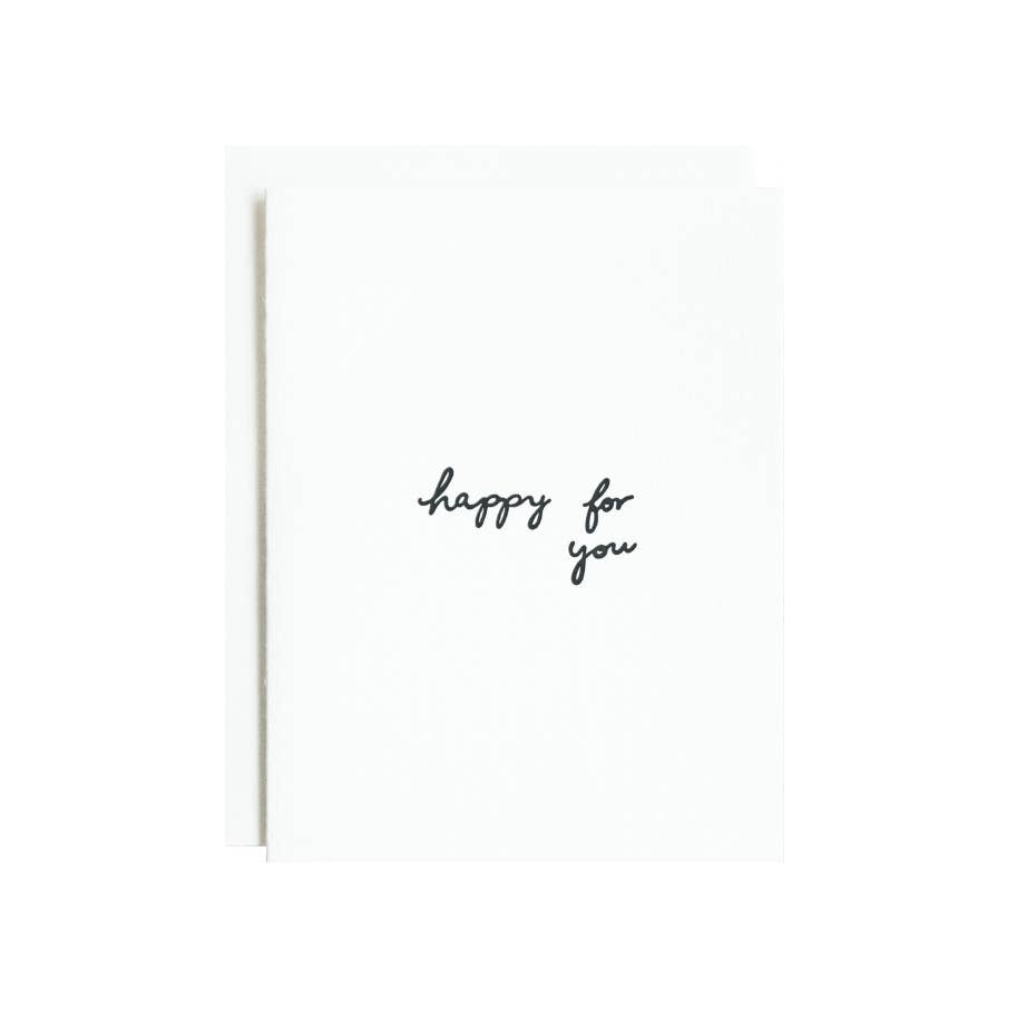 Greeting card with white background and black text says, "Happy for you". Envelope included.