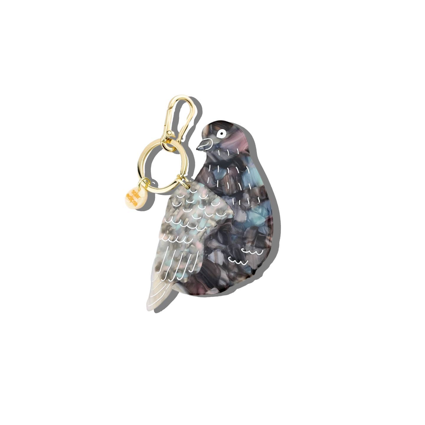 Image of key chain charm in the image of a pigeon in grey, black and white with gold colored key ring and clip. 