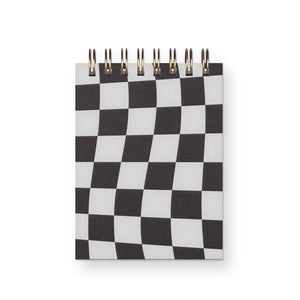 Notepad cover in black and white check pattern with coiled binding at the top. 