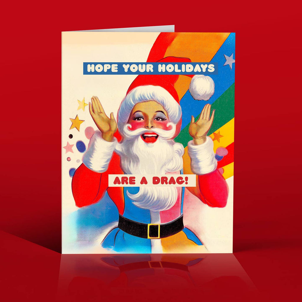 Greeting card with image of a drag queen Santa and white text says, "Hope your holidays" and red text says, "Are a drag!". Envelope included.