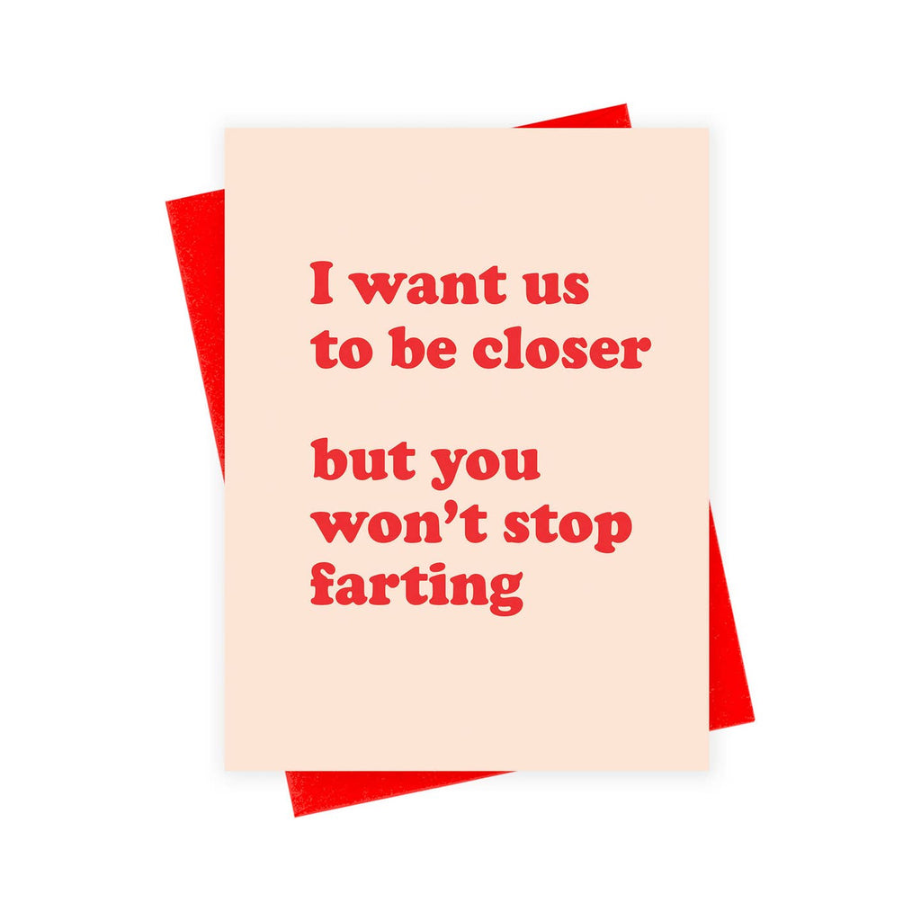 Greeting card with pink background and red text says, "I want us to be closer but you won't stop farting". Red envelope included. 