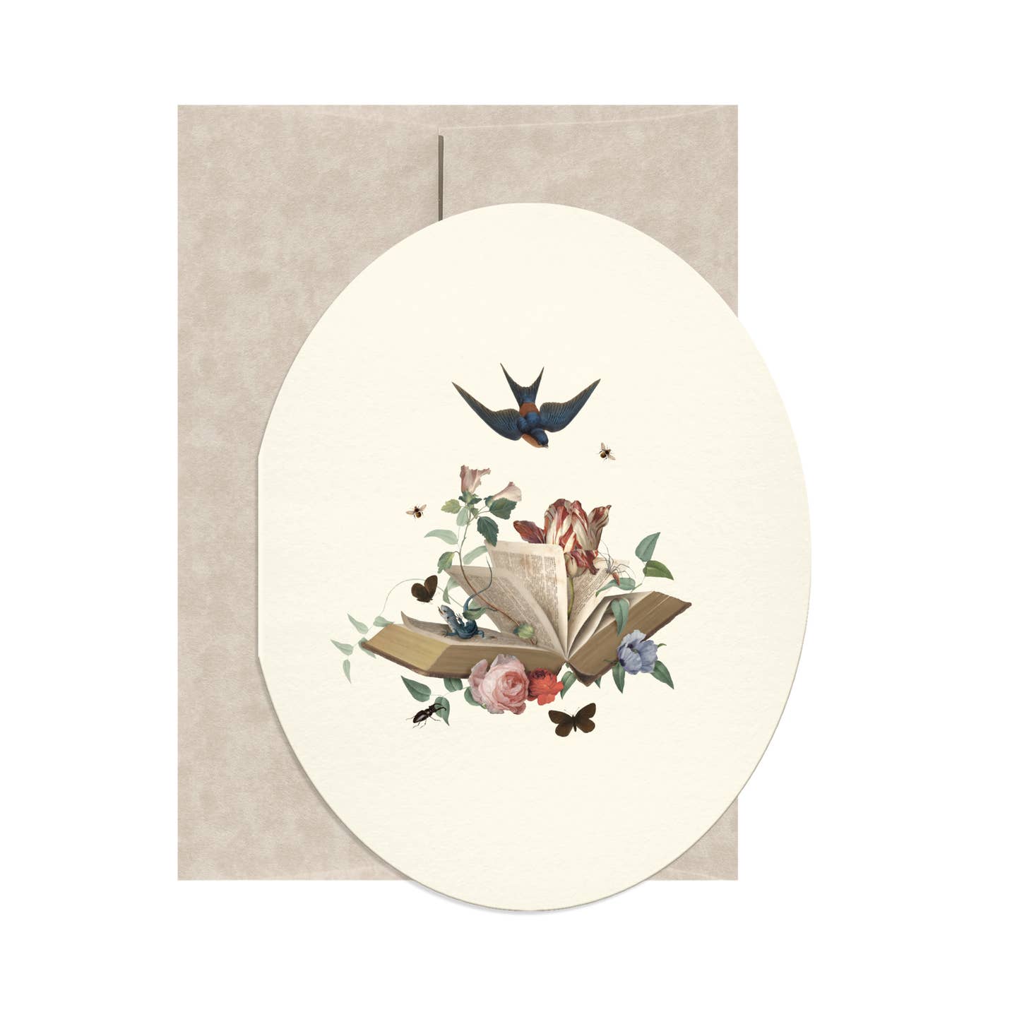 Oval shaped greeting card with cream background and image of an open book with flowers blooming out of it and a blue bird flying above it. Tan envelope included.
