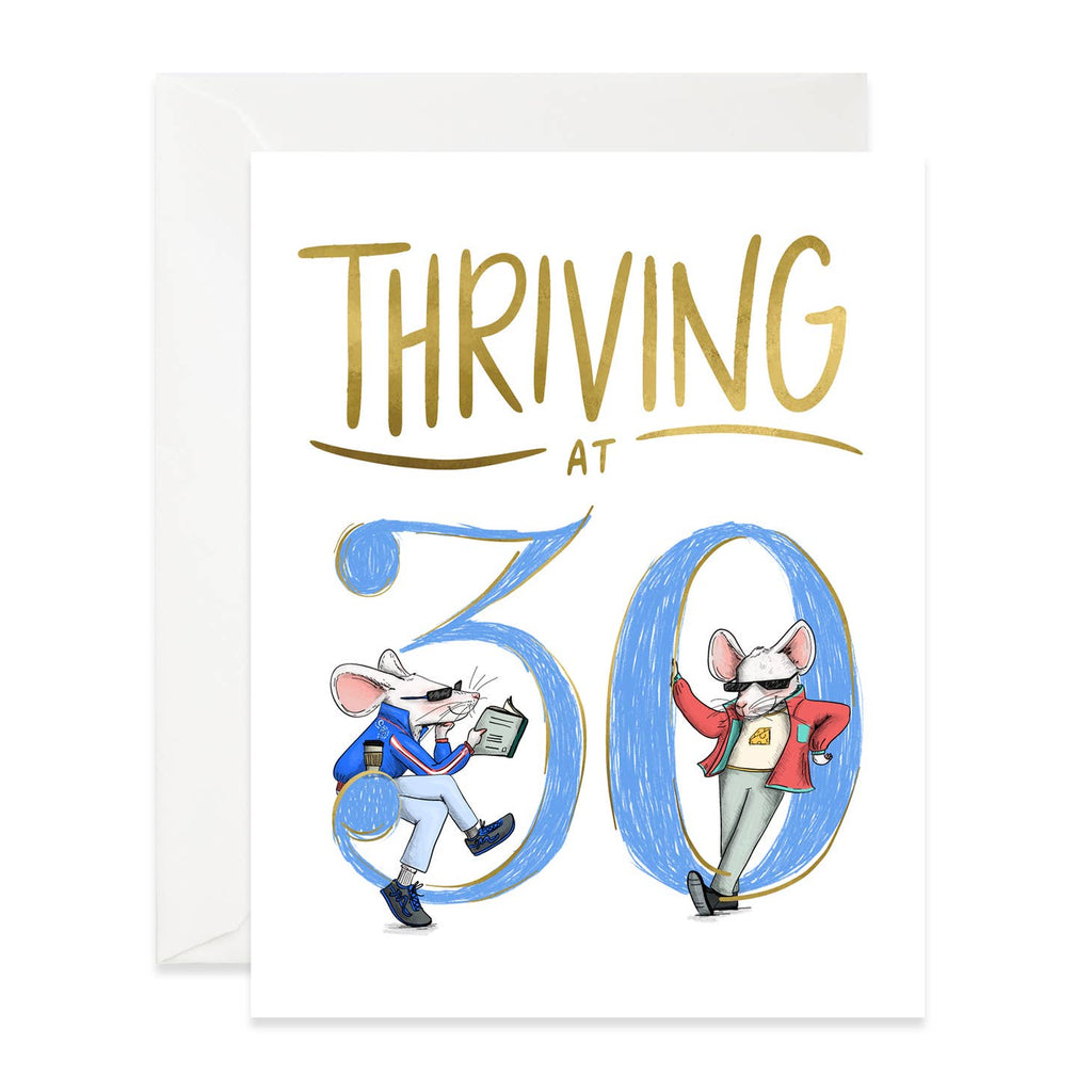 White background with image of blue "30" and tow mice dressed in workout wear reading book with pickle ball racket. Gold text says, "Thriving at". White envelope included. 