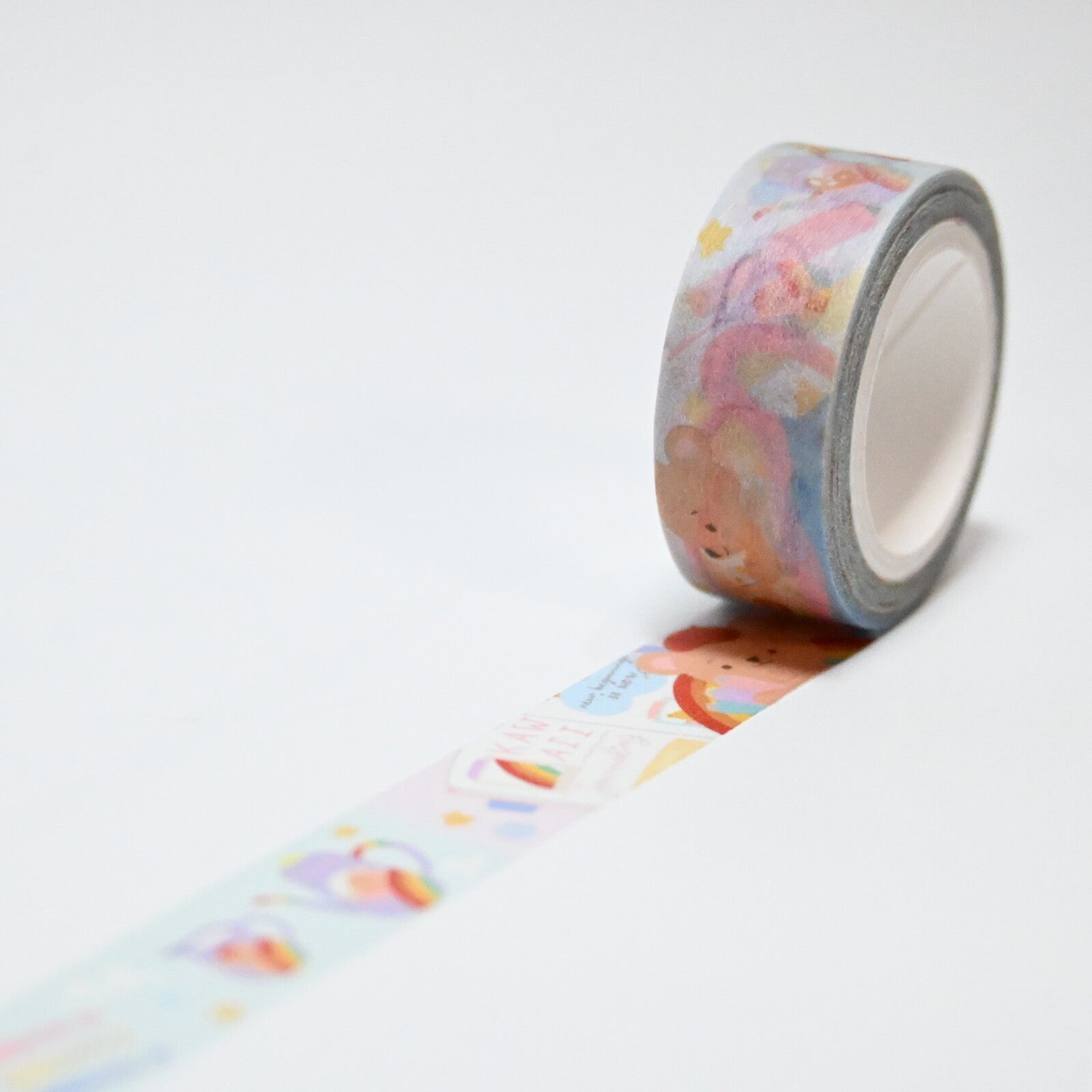 Decorative tape with blue background and images of items with rainbows on them.
