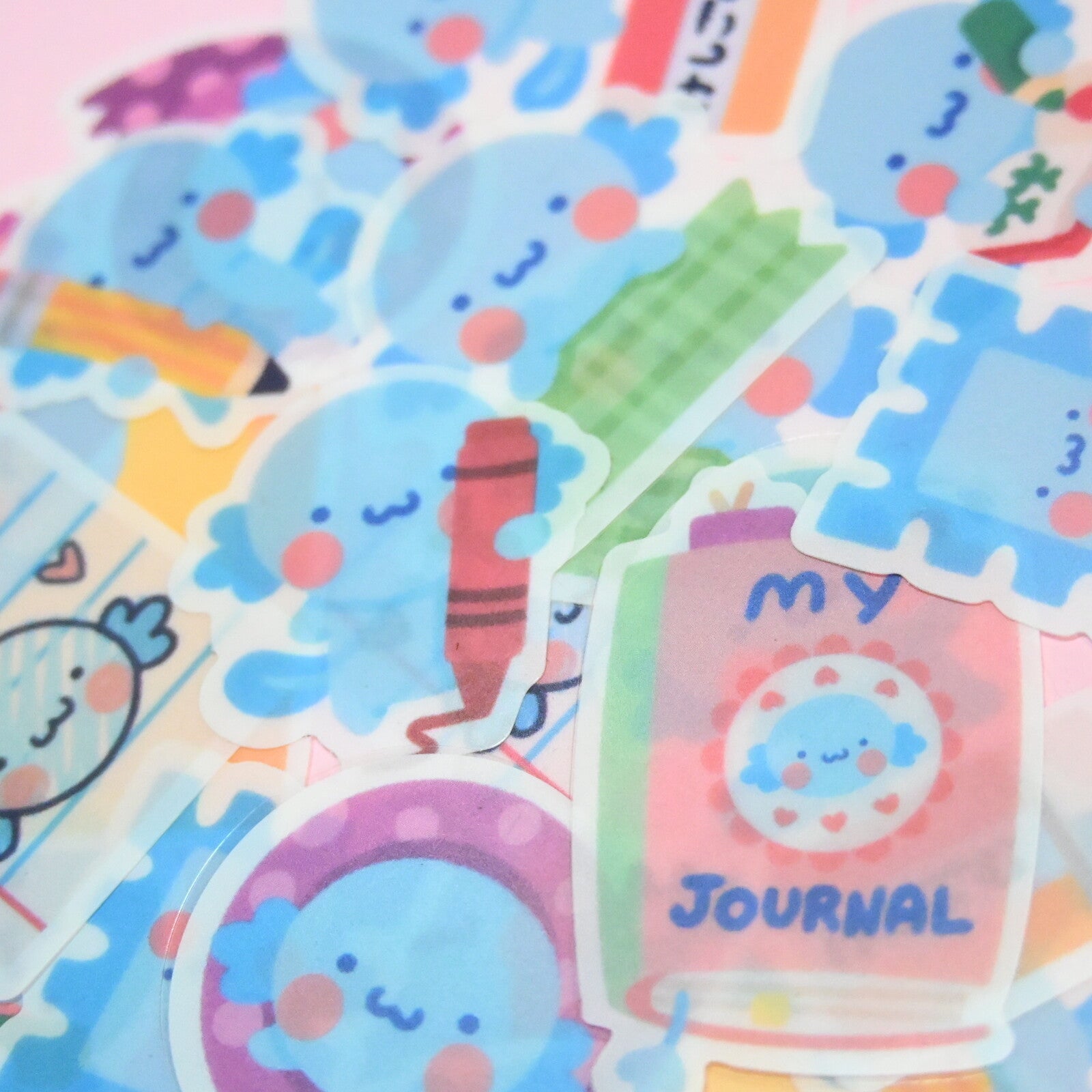 Package of stickers in the image of axoloti with stationery supplies.