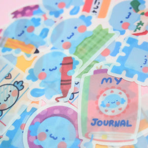 Package of stickers in the image of axoloti with stationery supplies.
