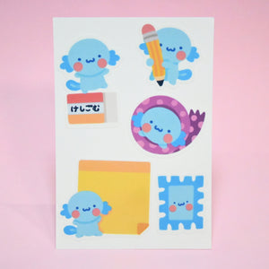 Package of stickers in the image of axoloti with stationery supplies.
