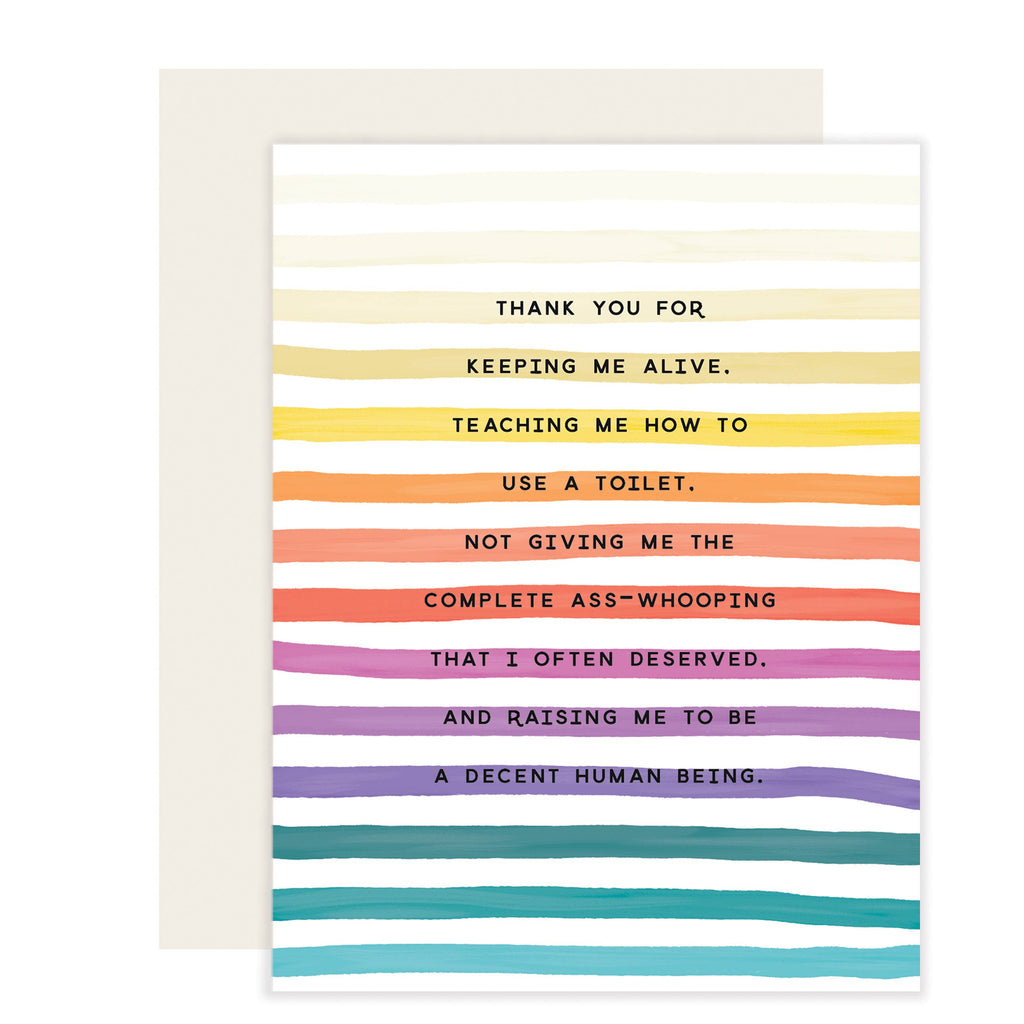 White card with black text saying, “Thank you for keeping me alive. Teaching me how to use a toilet. Not giving me the complete ass-whooping that I often deserved. And raising me to be a decent human being.” Images of colored horizontal rainbow stripes going down card. A white envelope is included.