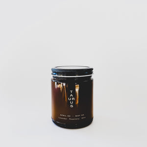 Image of brown glass jar with black lid and white text says, “Taurus”. 