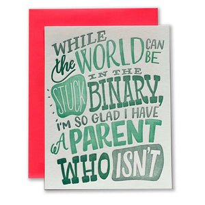 White background with green and grey text says, “While the world can be stuck in the binary, I’m so glad I have a parent who isn’t”. A red envelope is included.  