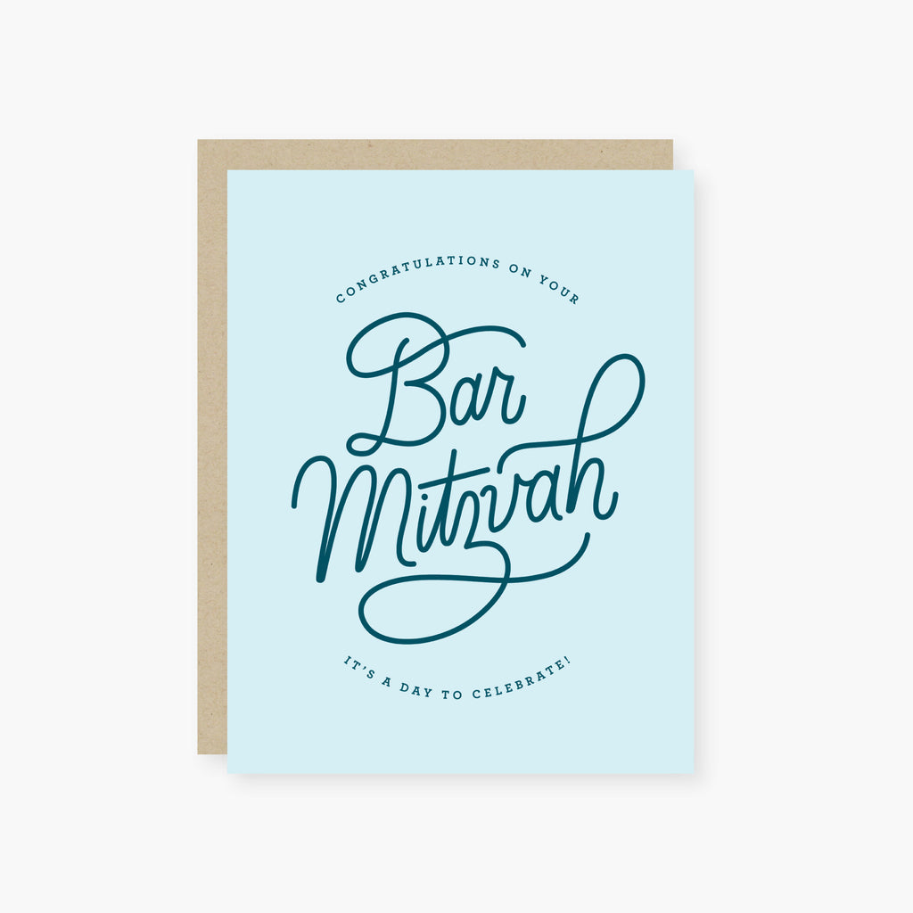 Blue card with dark blue text saying, “Congratulations on Your Bat Mitzvah It’s A Day to Celebrate!”  A gray envelope is included.