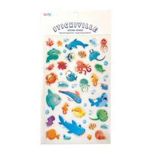 White background with images of jellyfish, pufferfish, whales, sharks, octopus, coral, crabs. 