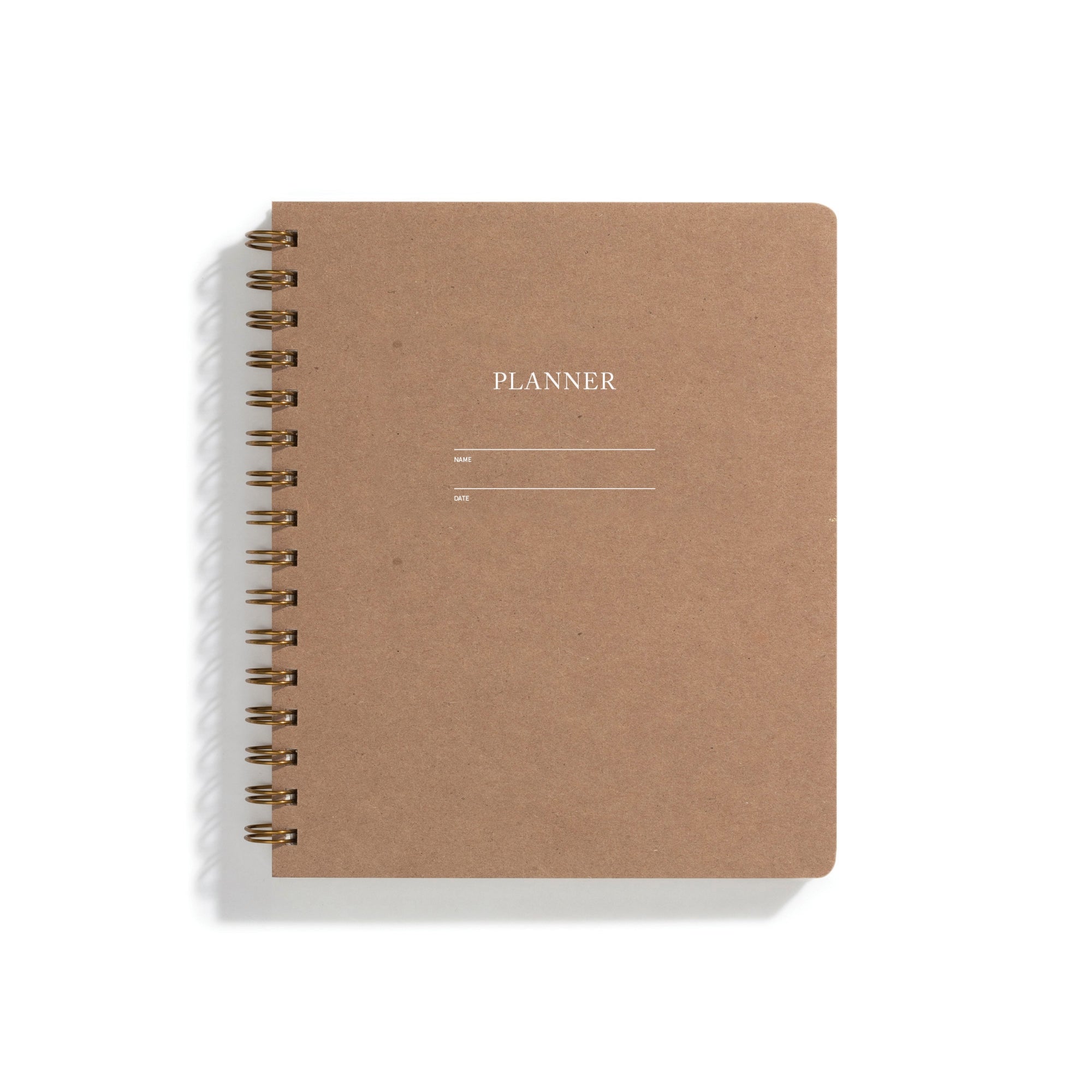 Image of brown cover with letter pressed text says, “Planner”. “Name” and “Date” with lines for writing. Coiled binding on left side.