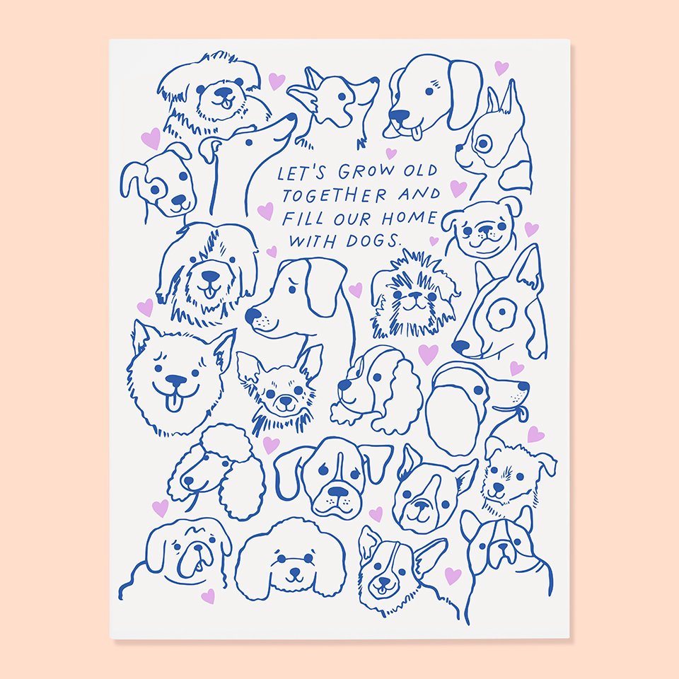 White card with blue text saying, “Let’s Grow Old Together and Fill Our Home With Dogs”. Images of various dogs and purple hearts. An envelope is included.