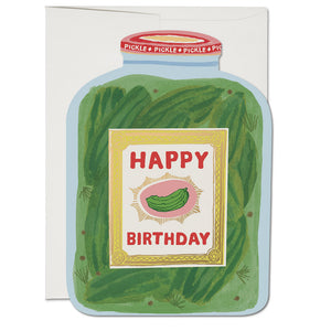 Blue card in the shape of a pickle jar with image of a jar of pickles with a red cap and gold label with red text saying, “Happy Birthday”. A white envelope is included.