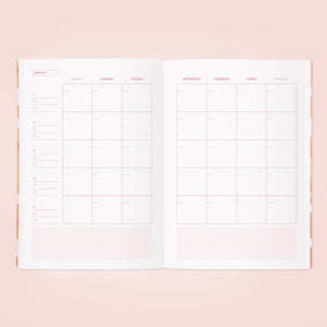 Image of month page with blocks for days of month in pink text.    