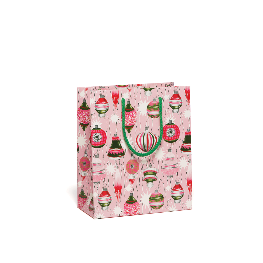 Image of gift bag with pink background with images of holiday ornaments in pink, red, green and white with strings and green cord handle. 