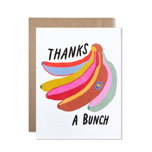 White card with black text saying, “Thanks A Bunch”. Images of a bunch of colorful bananas. A brown envelope is included.