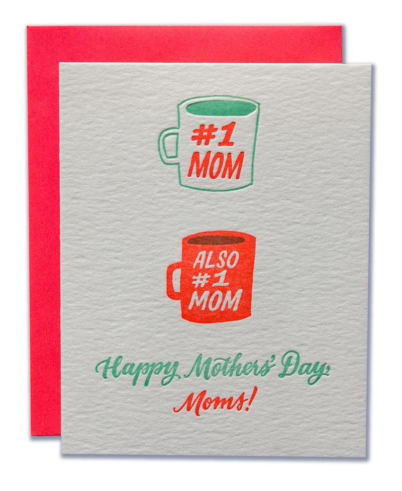 Gray card with teal and orange script text saying,"Happy Mother's Day, Dads!" Images of two teal and orange coffee cups, one saying "#1 Mom", the other saying "Also #1 Mom". A red envelope is included.