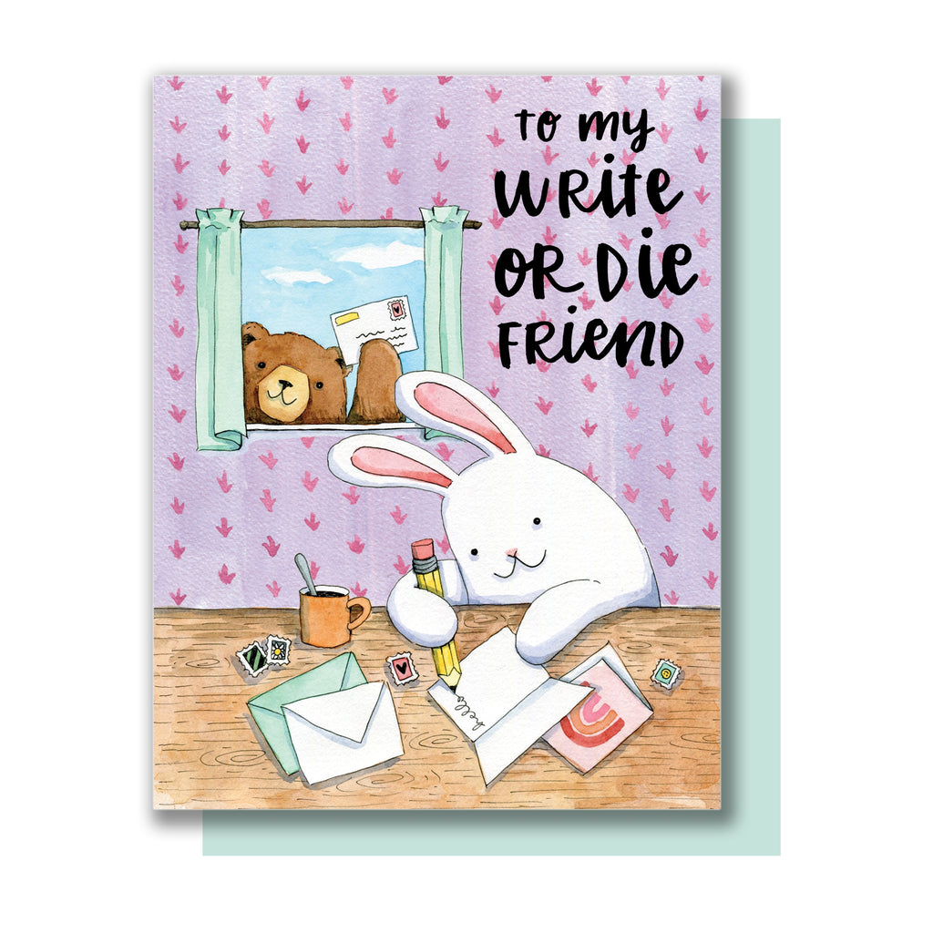 Card with images of a room in a house with purple wallpaper and a brown table. White rabbit at table writing out cards and envelopes. Brown bear peeking in window showing the mail he received. Black text saying, “To My Write or Die Friend”.  A blue envelope is included.