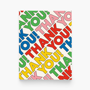 White card with rainbow text saying, "Thank You!" repeated across the card. An envelope is included.