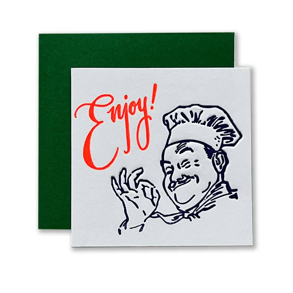 White background with black drawing of Chef Boy-R-Dee and red text says, “Enjoy!”. Green envelope included.      