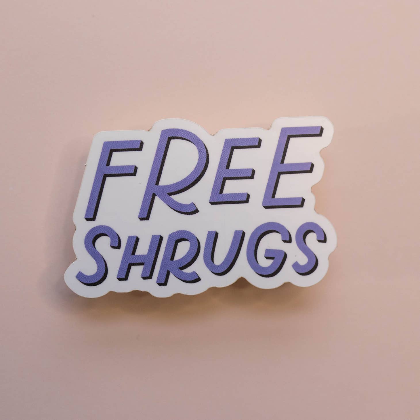 White background with "Free Shrugs" in light purple letters