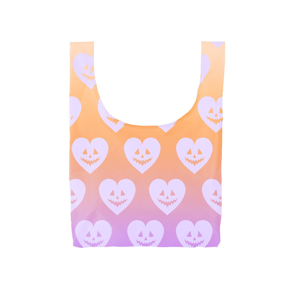 Image of orange and purple tote with images of heart shape with jack o'lantern face. 