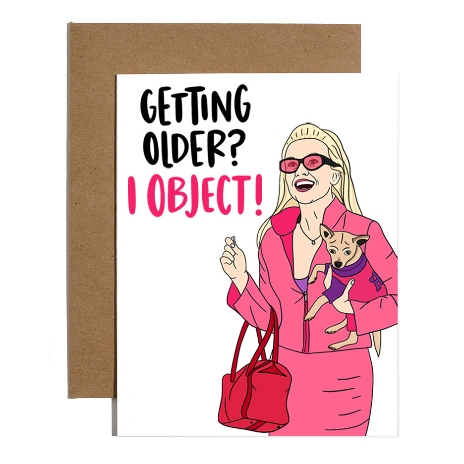 White card with black and pink text saying, "Getting Older? I Object!" Image of blonde woman wearing a pink suit holding a small brown dog. A brown envelope is included.