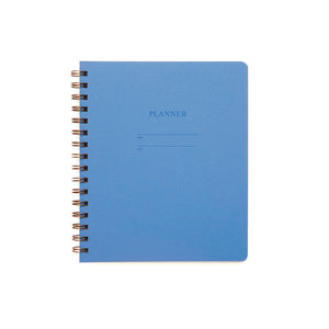 Image of ocean blue cover with letter pressed text says, “Planner”. “Name” and “Date” with lines for writing. Coiled binding on left side.