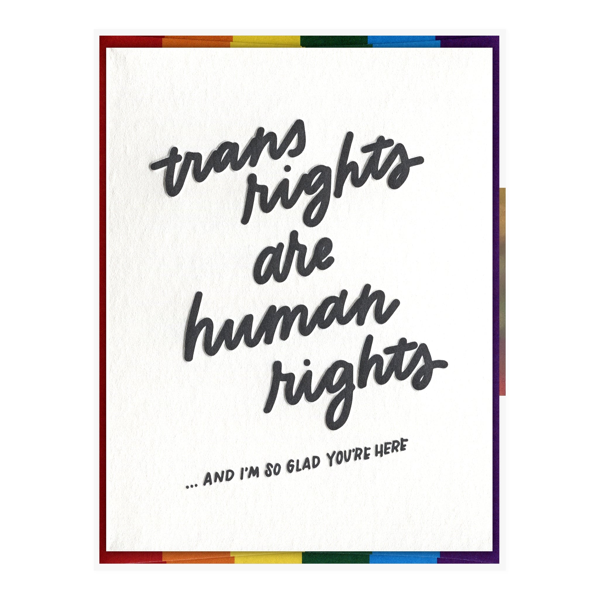 White card with blue script text saying, “Trans Rights Are Human Rights….And I’m So Glad You’re Here”. A rainbow striped envelope is included.