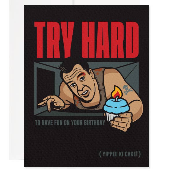 Black background with image of Bruce Willis in Die Hard crawling through a air duct with a cupcake in his hand. Cupcake has blue frosting and on lit candle. Red text says “Try hard”. Grey text says “To have fun on your birthday”.  In lower right corner says “(uippee Ki Cake!) in grey text. 