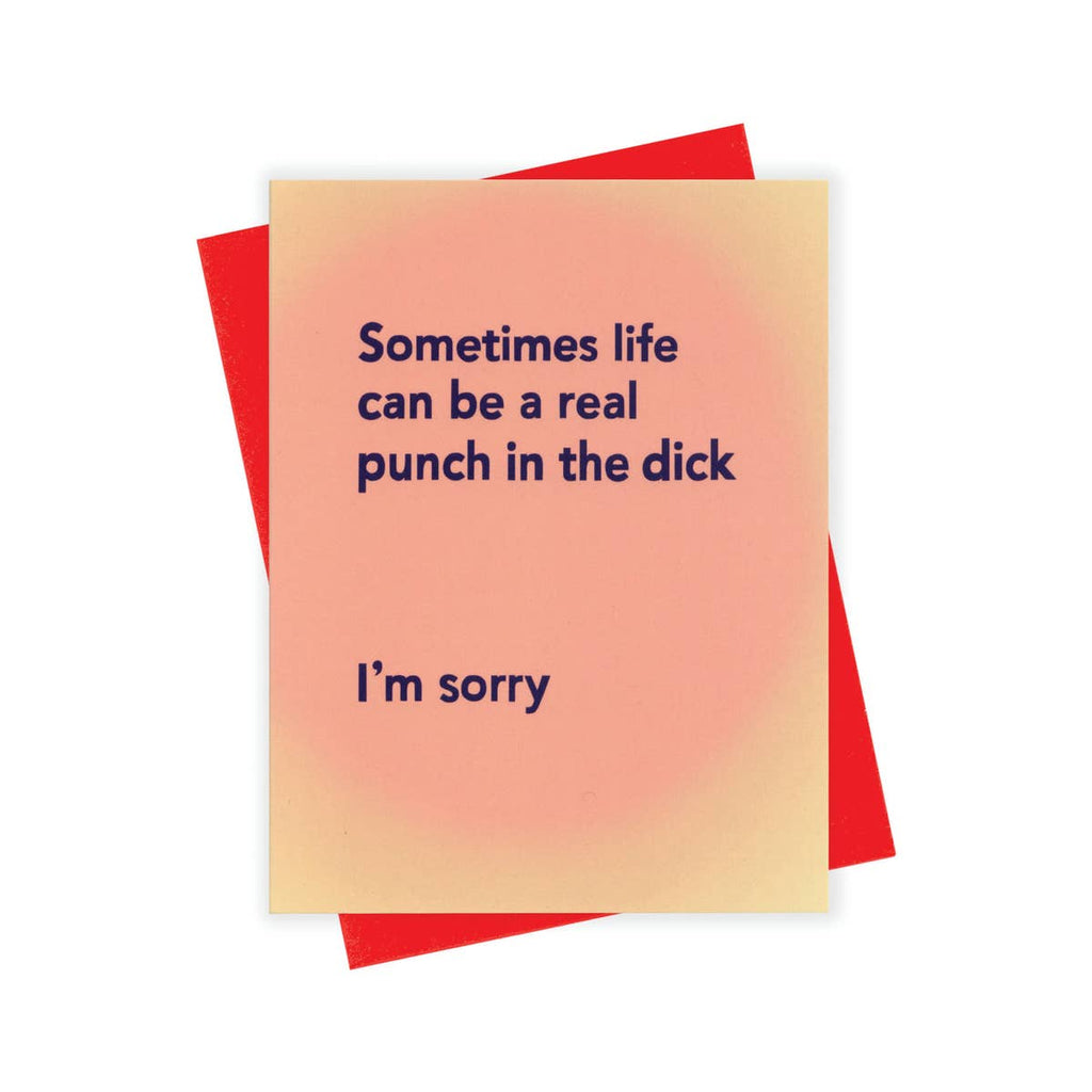 Peach card with blue text saying, “Sometimes life can be a real punch in the dick. I’m Sorry.” A red envelope is included.