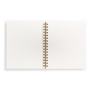 Image of opened notebook with ivory background and light blue lines. 