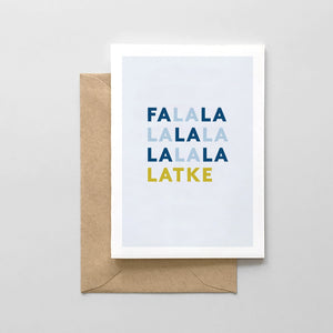 White card with light blue background with blue amd gold text saying, "FaLaLa LaLaLa LaLaLa Latke". A brown envelope is included.