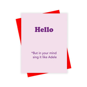 Pink card with purple text saying, “Hello *But in your mind sing it like Adele”. A red envelope is included.